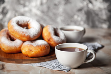 Donuts sprinkled with powdered sugar