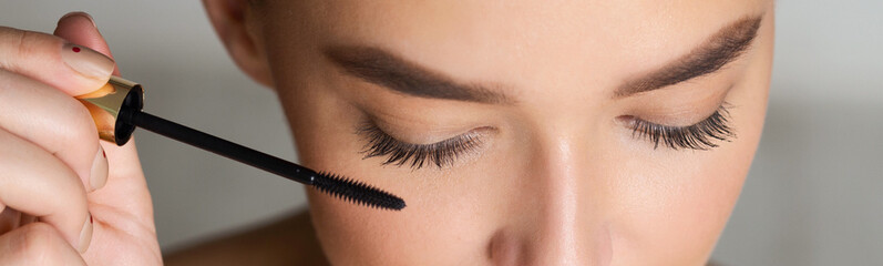 Woman Doing Makeup, Applying Black Mascara, Closeup