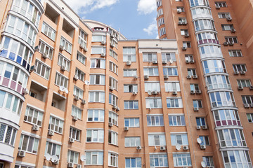 Fototapeta na wymiar Modern apartment buildings on a sunny day. Facade of a modern apartment building