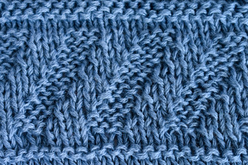 Knitting diagonal pattern of natural blue wool