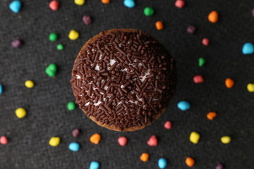Chocolate Crinkle cookies. close-up of Crinkle cookies chocolate biscuits on Christmas cookies on a black plate, view from above.