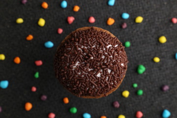 Chocolate Crinkle cookies. close-up of Crinkle cookies chocolate biscuits on Christmas cookies on a black plate, view from above.