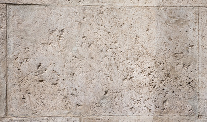 Background of fragment of old Roman stone wall