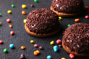 Chocolate Crinkle cookies. close-up of Crinkle cookies chocolate biscuits on Christmas cookies on a black plate, view from above.