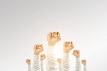 Businessmen raised their hands to win the celebration of the organization.The concept of business is geared towards success,sunlight effect.