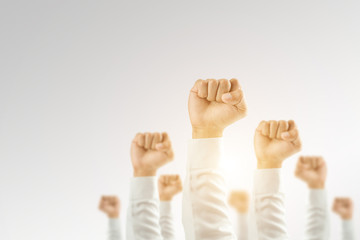 Businessmen raised their hands to win the celebration of the organization.The concept of business is geared towards success,sunlight effect.