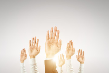 Businessmen raised their hands to win the celebration of the organization.The concept of business is geared towards success,sunlight effect.