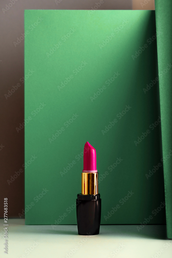 Wall mural pink lipstick on modern minimalist background, concept of makeup