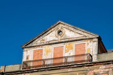 Abandoned building with windows covered in bricks