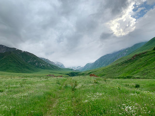 Fototapeta premium Russia, North Ossetia. Mountains forming the Zrug gorge in cloudy weather
