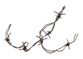 Old rusty security barbed wire fence isolated on white background and texture