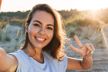 Beautiful young woman having a lovely time at the beach