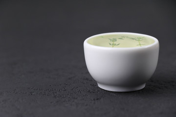 Italian oil on black background