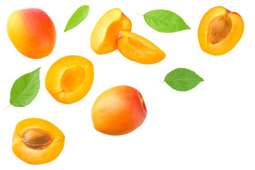 apricot fruits with slices and green leaf isolated on white background. top view