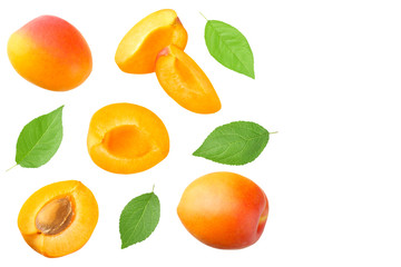 apricot fruits with slices and green leaf isolated on white background. top view