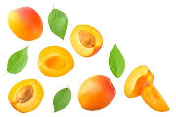 apricot fruits with slices and green leaf isolated on white background. top view