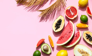 Summer tropical fruits background with strong contrast sunny shadow