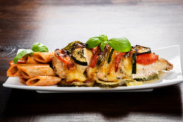 baked chicken breast with mozzarella and vegetables