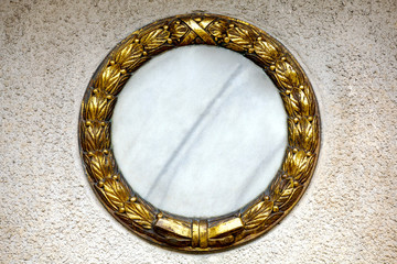 gold wreath at a gravestone