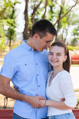 summer evening in love couple in the park sunbeams happiness