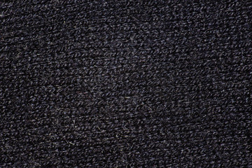 Dark fabric knitted texture is macro