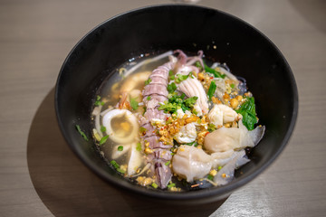 Thai Tom Yum spicy lime seafood noodle with mantis shrimp