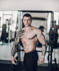 beautiful bodybuilder trainer showing off his body