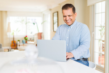 Middle age man using computer laptop
