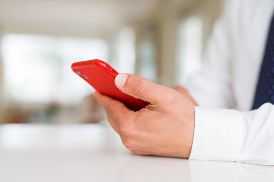 Close up of business man hands using smarpthone