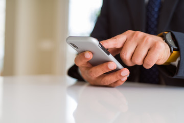 Close up of business man hands using smarpthone
