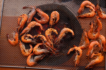 Fresh shrimp from freshwater and  squid on stove Grill