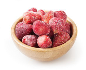 Frozen strawberries in wooden bowl isolated on white background