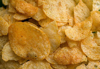 Natural looking fresh potato chips. Macro with shallow depth of field.