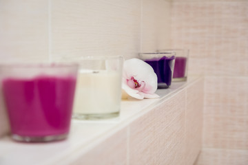 candles in the bathroom in the form of an orchid