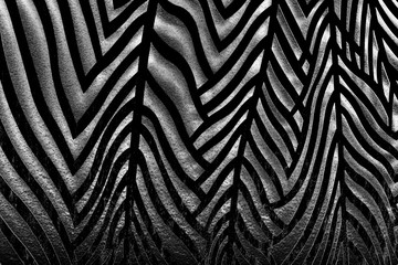 abstract contrasting black and white wall texture with three-dimensional striped pattern