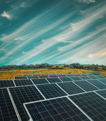 Solar energy power plant over a beautiful cloudy sky