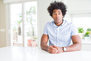 African American business man skeptic and nervous, frowning upset because of problem. Negative...
