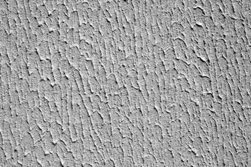 Plaster wall texture with interesting pattern in black and white.