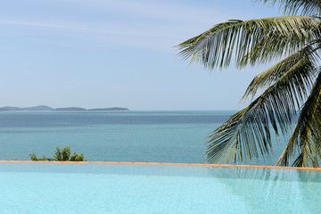 View of the ocean from the luxurious swimming pool. Tropical resort