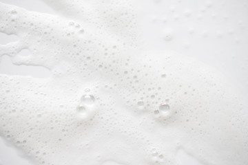 Abstract background white soapy foam texture. Shampoo foam with bubbles