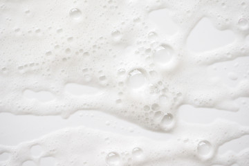 Abstract background white soapy foam texture. Shampoo foam with bubbles