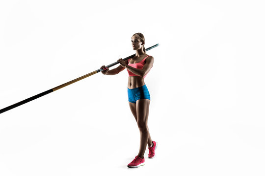 Power and beauty and purity. Professional female pole vaulter training on white studio background. Fit and slim female model practicing. Concept of sport, healthy lifestyle, action, movement, motion.