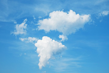 Two clouds naturally shaped like eurasia and africa continents. Close up, copy space for text, background.