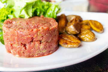 tasty Steak tartare (Raw beef) - classic steak tartare on white plate