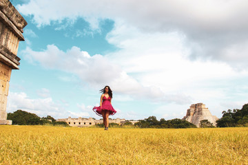 Girl in mayan ruins of the ancient city in Uxmal, Yucatan, Mexico