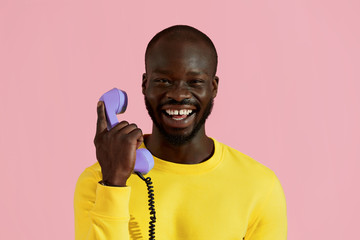 Smiling black man with purple phone colorful portrait