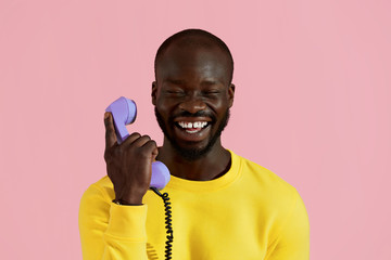 Smiling black man with purple phone colorful portrait