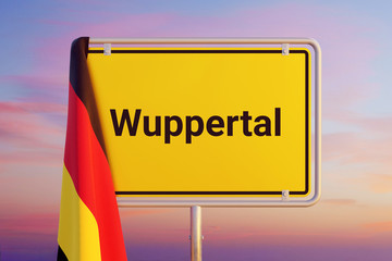 Wuppertal. Gelbes Schild/Ortsschild. Flagge von Deutschland hängt darüber. Himmel mit Sonnenuntergang oder Sonnenaufgang