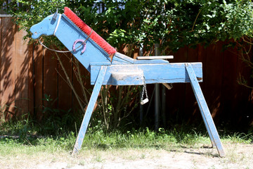  Wooden horse for children learning to ride in a riding school