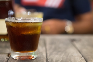 Cool iced soft drink cola carbonated liquid fresh food with soda water in clear glass.